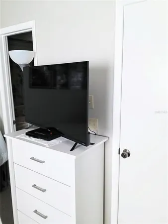 a bedroom with furniture and a bed