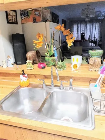 a stove top oven sitting inside of a kitchen