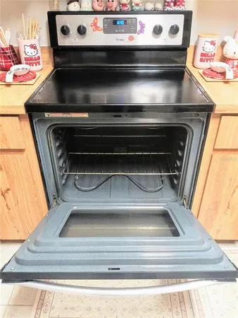 a view of a dining room with furniture and window