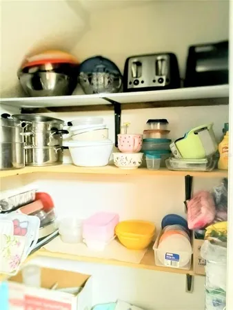a kitchen with a table and chairs and couches in a kitchen