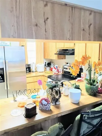 a view of living room with furniture and a flat screen tv