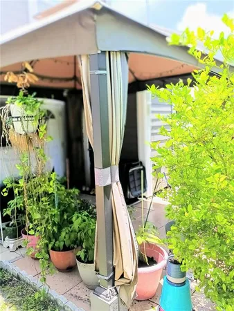 a view of a house with swimming pool and sitting area
