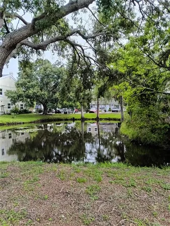 a house with potted plants in front of door