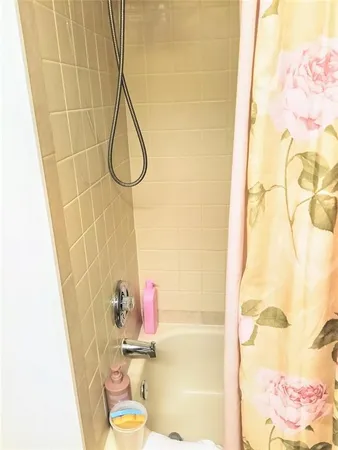 a bathroom with a sink and a shower curtain