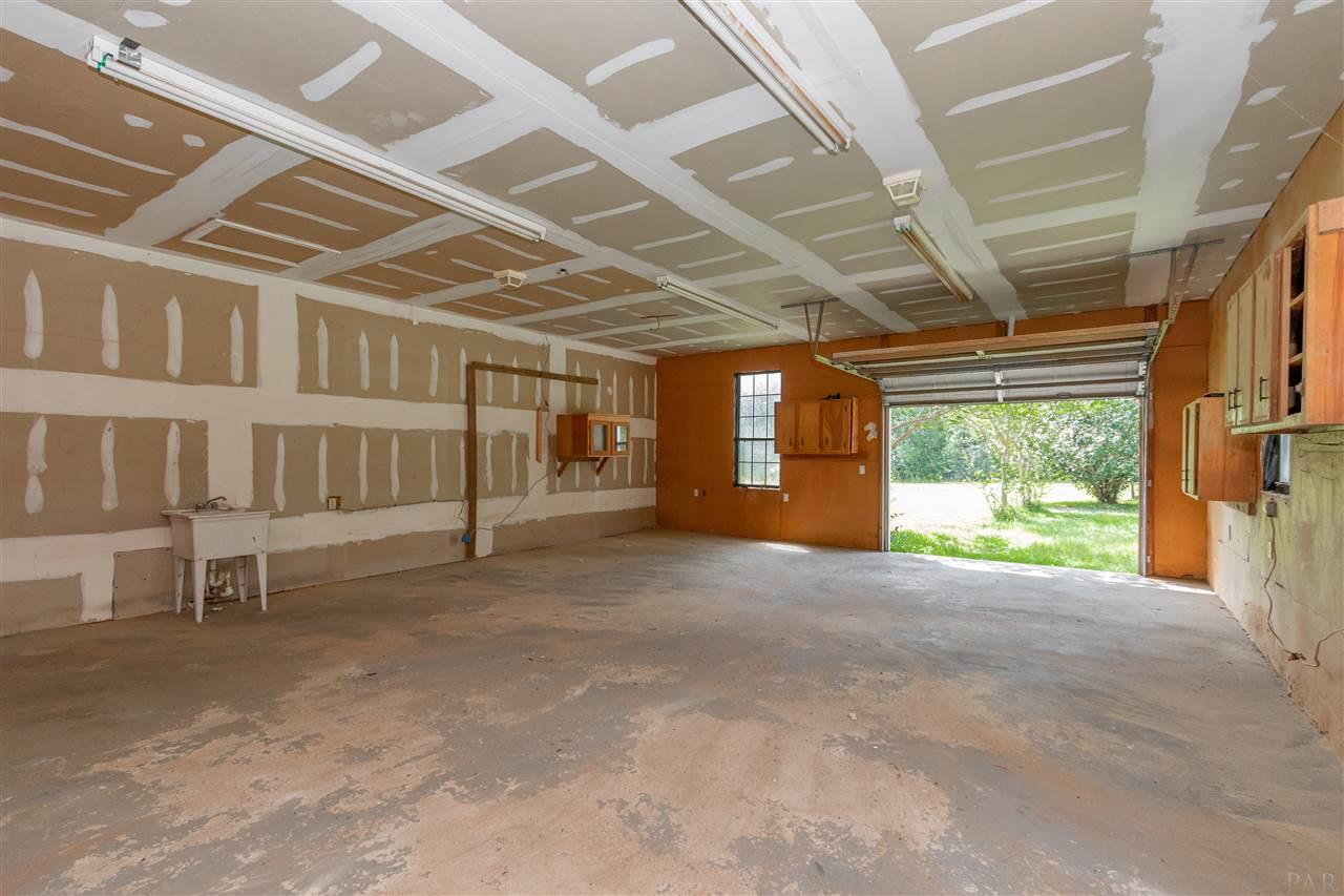9890 Red Rock Road Milton, FL 32570 - Photo 29 of 36 Single garage door but you can easily fit 2 cars