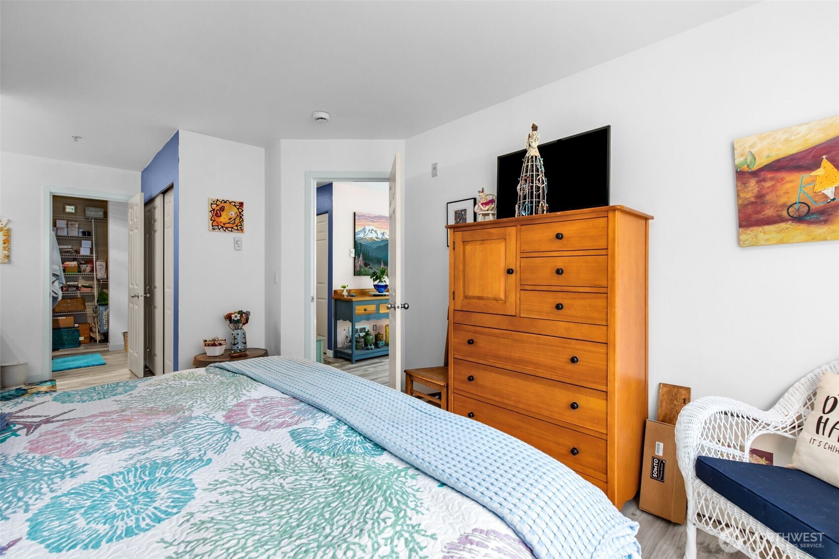 20800 72nd Avenue West, Unit 202 Edmonds, WA 98026 - Photo 19 of 34 a bedroom with a bed and wooden floor