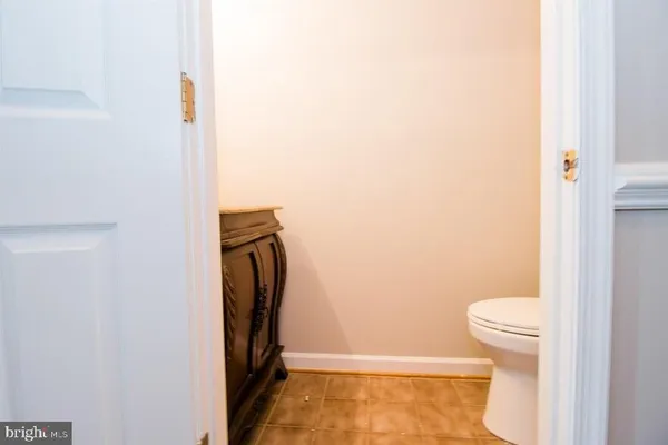 a front view of a house with outdoor plants