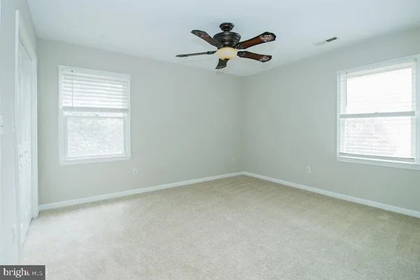 a kitchen with granite countertop a stove and a refrigerator