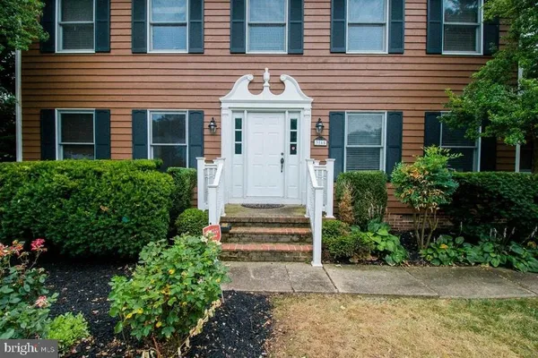 a view of a house with a yard and garage