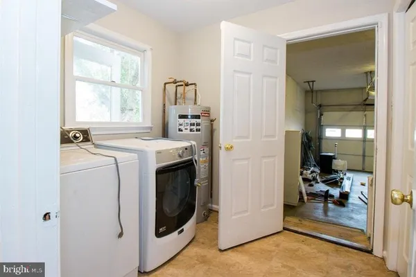 a kitchen with stainless steel appliances granite countertop a stove refrigerator and a microwave