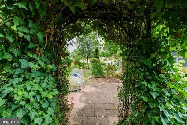 a kitchen with stainless steel appliances granite countertop a refrigerator stove and a sink
