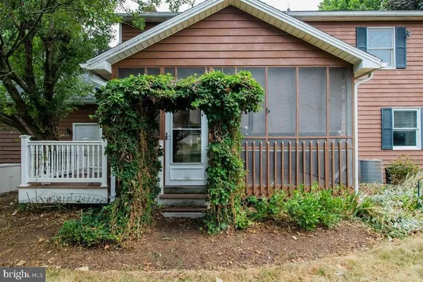 a kitchen with stainless steel appliances granite countertop a refrigerator a sink dishwasher a stove a microwave oven with cabinets and wooden floor