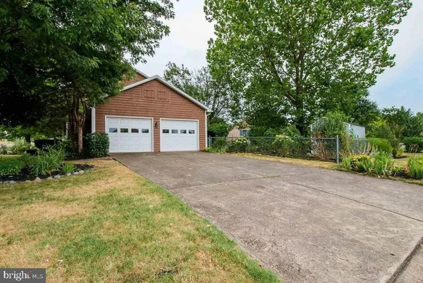 a view of empty room with a fireplace and fan