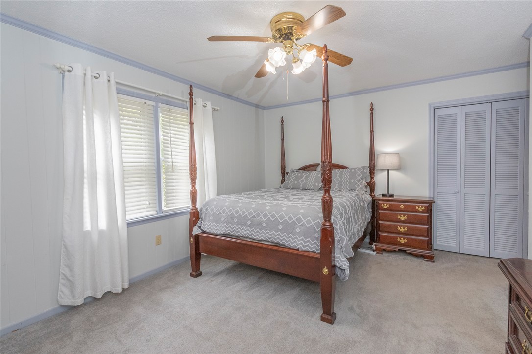 1116 Leatherdale Road Iva, SC 29655 - Photo 36 of 46 This cozy bedroom features a four-poster bed, window, and closet for comfortable living.