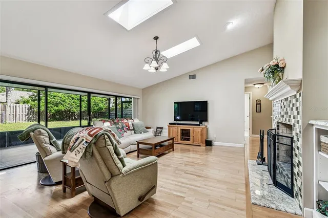 a kitchen with stainless steel appliances granite countertop a stove a sink a microwave a dining table and chairs