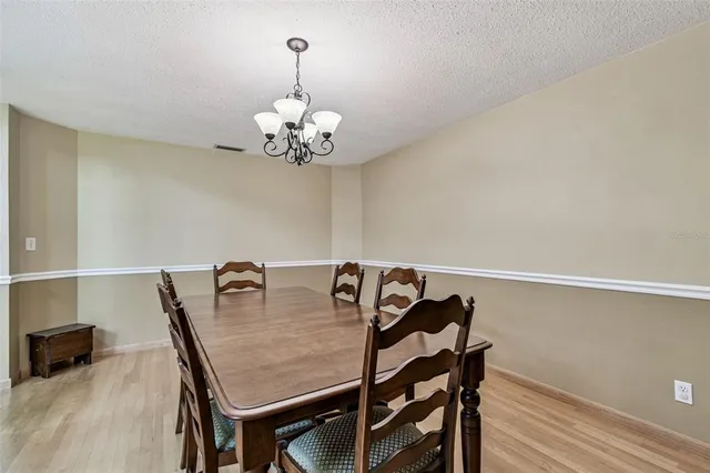 a bathroom with a sink and mirror with shower