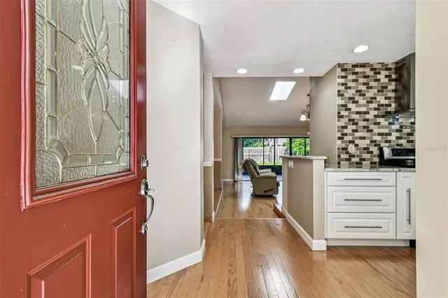 a view of entryway with livingroom and wooden floor