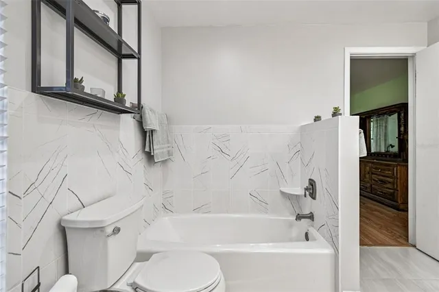 a view of a garden with a building in the background