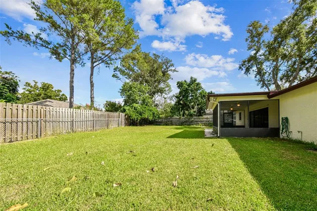 an aerial view of residential houses with outdoor space and street view