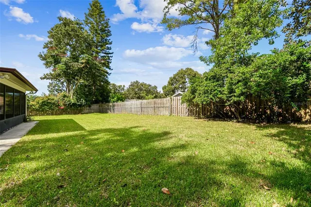 an aerial view of residential houses with outdoor space and street view