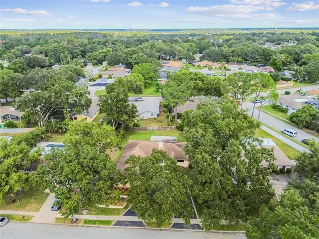 a view of a swimming pool and a patio