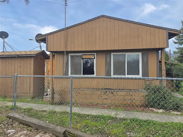 a house with trees in the background
