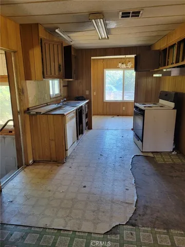 a view of a kitchen with furniture and a window