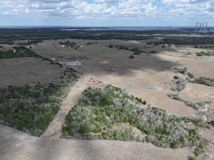 a view of dirt road with beach