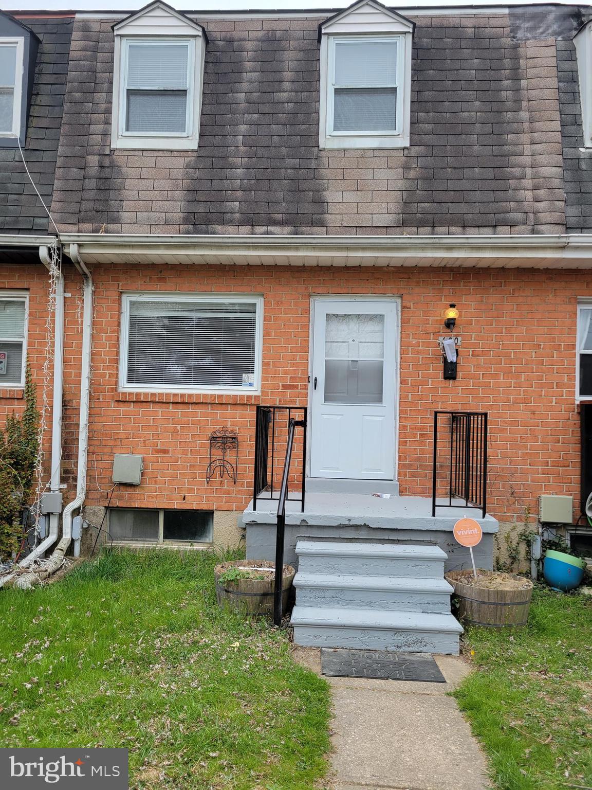 630 Kingston Road Baltimore, MD 21220 - Photo 2 of 34 a front view of a house with garden