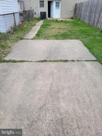 a view of a yard with a bench