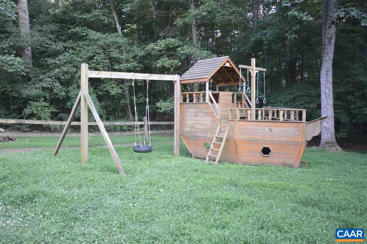 389 Morning Glory Road Ruckersville, VA 22968 - Photo 16 of 34 a view of a house with a backyard and a slide