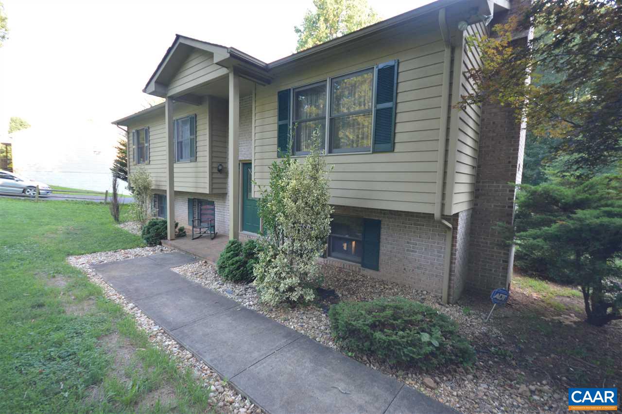 389 Morning Glory Road Ruckersville, VA 22968 - Photo 22 of 34 a front view of a house with garden