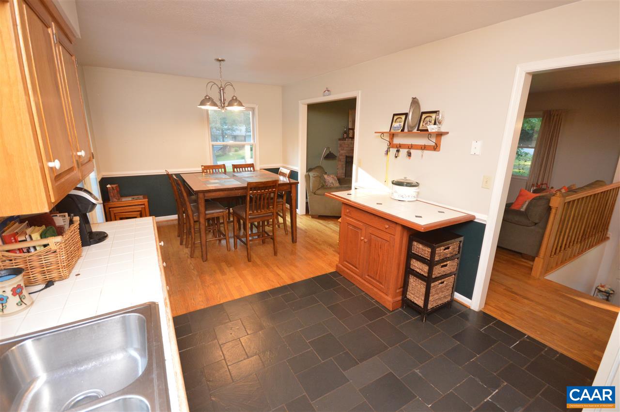 389 Morning Glory Road Ruckersville, VA 22968 - Photo 26 of 34 a dining room with furniture and wooden floor