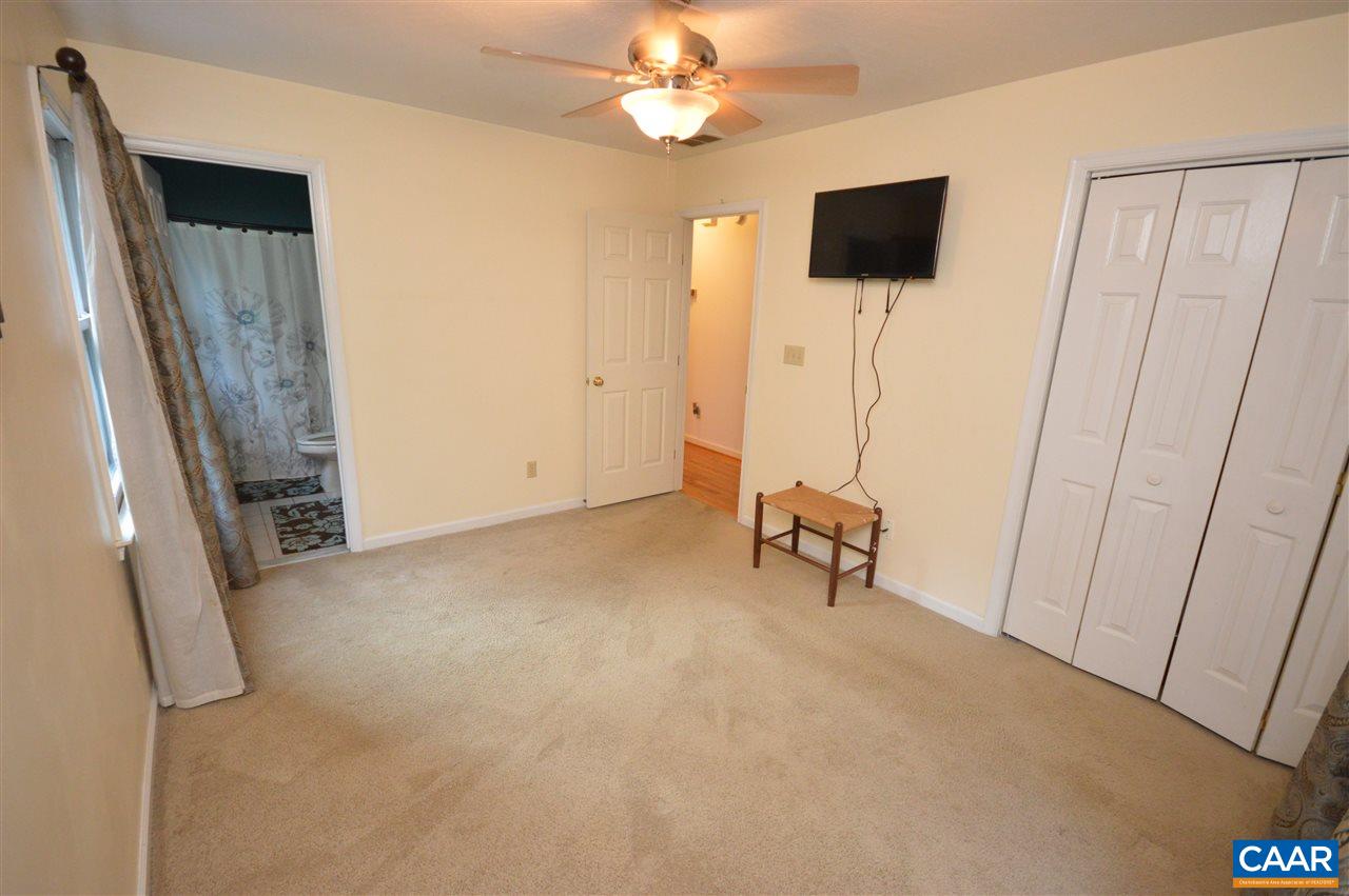 389 Morning Glory Road Ruckersville, VA 22968 - Photo 27 of 34 a view of a livingroom with a flat screen tv