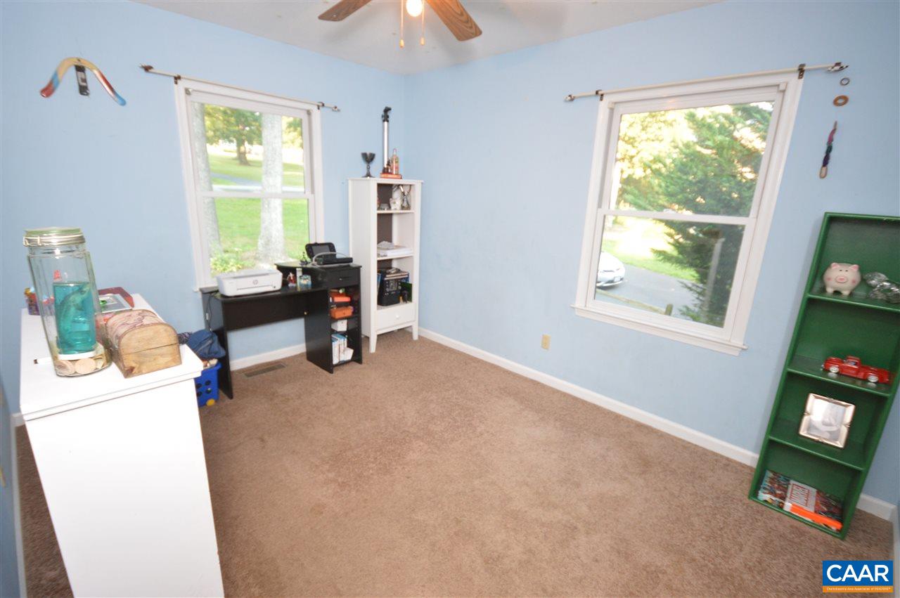 389 Morning Glory Road Ruckersville, VA 22968 - Photo 28 of 34 a living room with furniture and a window