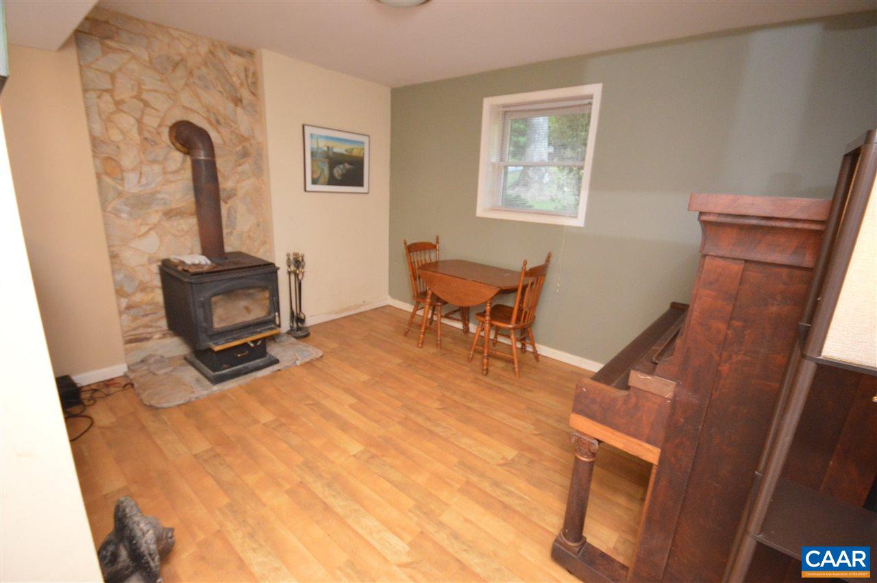 389 Morning Glory Road Ruckersville, VA 22968 - Photo 32 of 34 a bedroom with furniture and a window