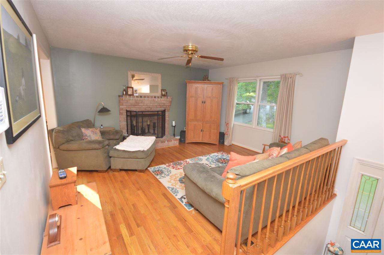 389 Morning Glory Road Ruckersville, VA 22968 - Photo 4 of 34 a bed room with a bed and a chandelier