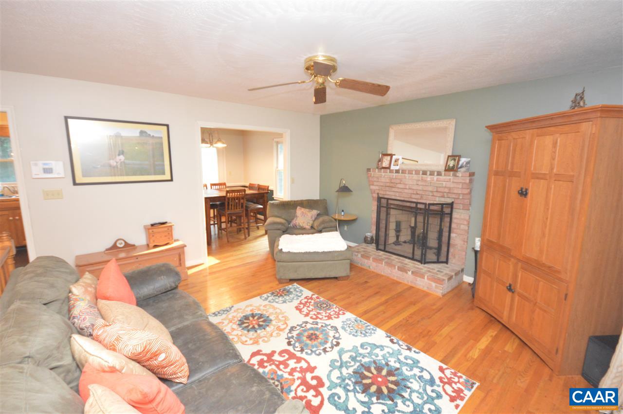 389 Morning Glory Road Ruckersville, VA 22968 - Photo 5 of 34 a living room with furniture and a fireplace