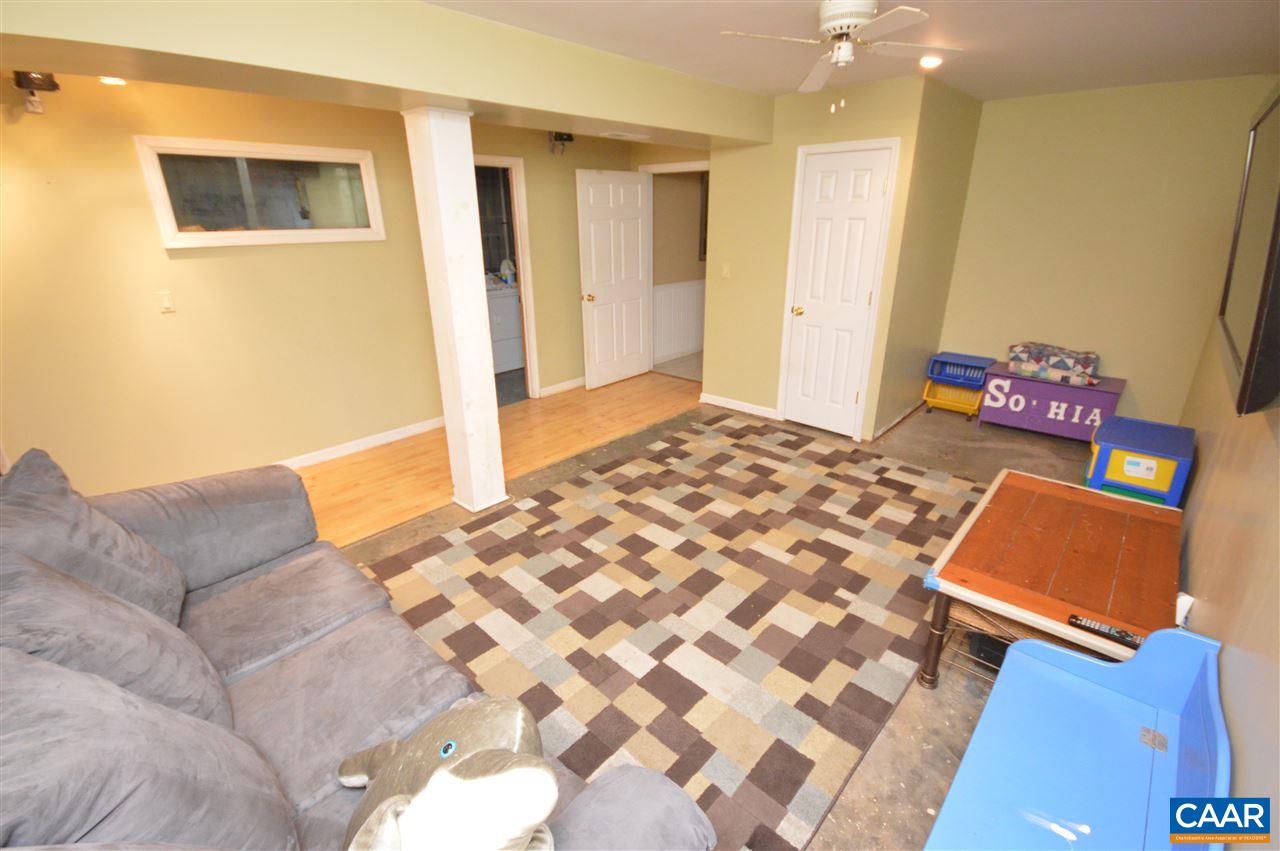 389 Morning Glory Road Ruckersville, VA 22968 - Photo 8 of 34 a bedroom with a bed and a couch