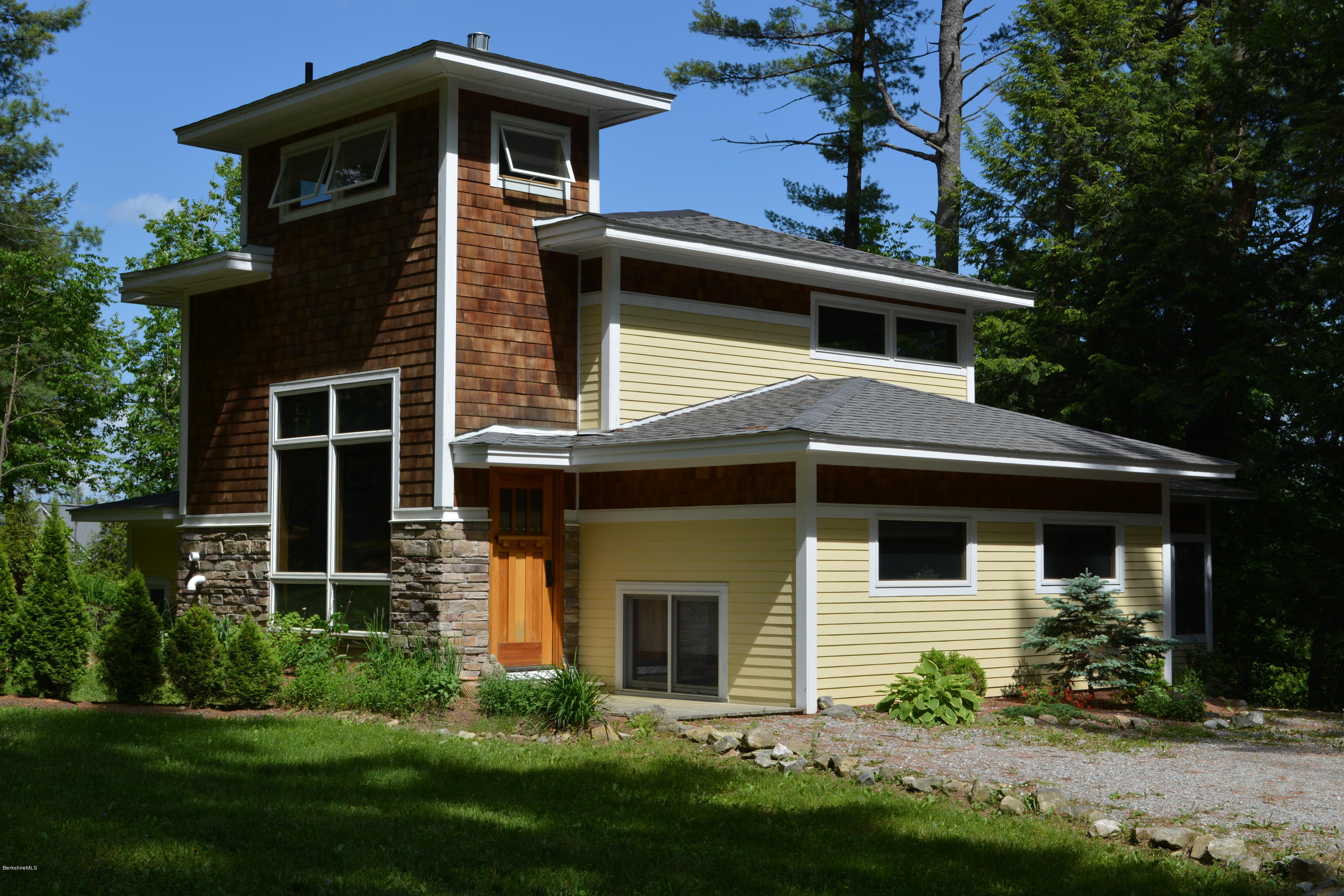 317 Pine Road Otis, MA 01029 - Photo 1 of 27 a front view of a house with a yard