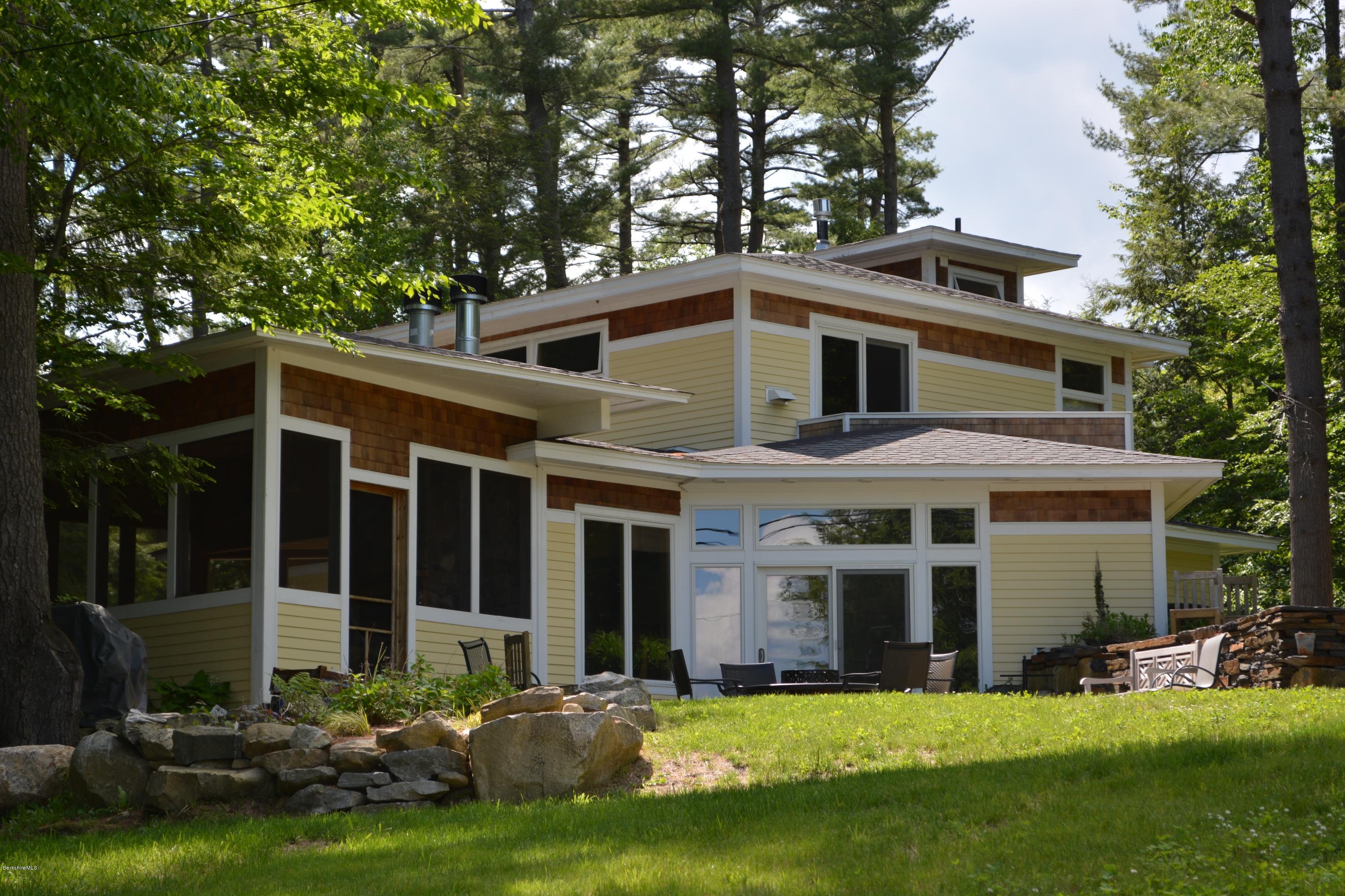 317 Pine Road Otis, MA 01029 - Photo 2 of 27 a front view of a house with a yard