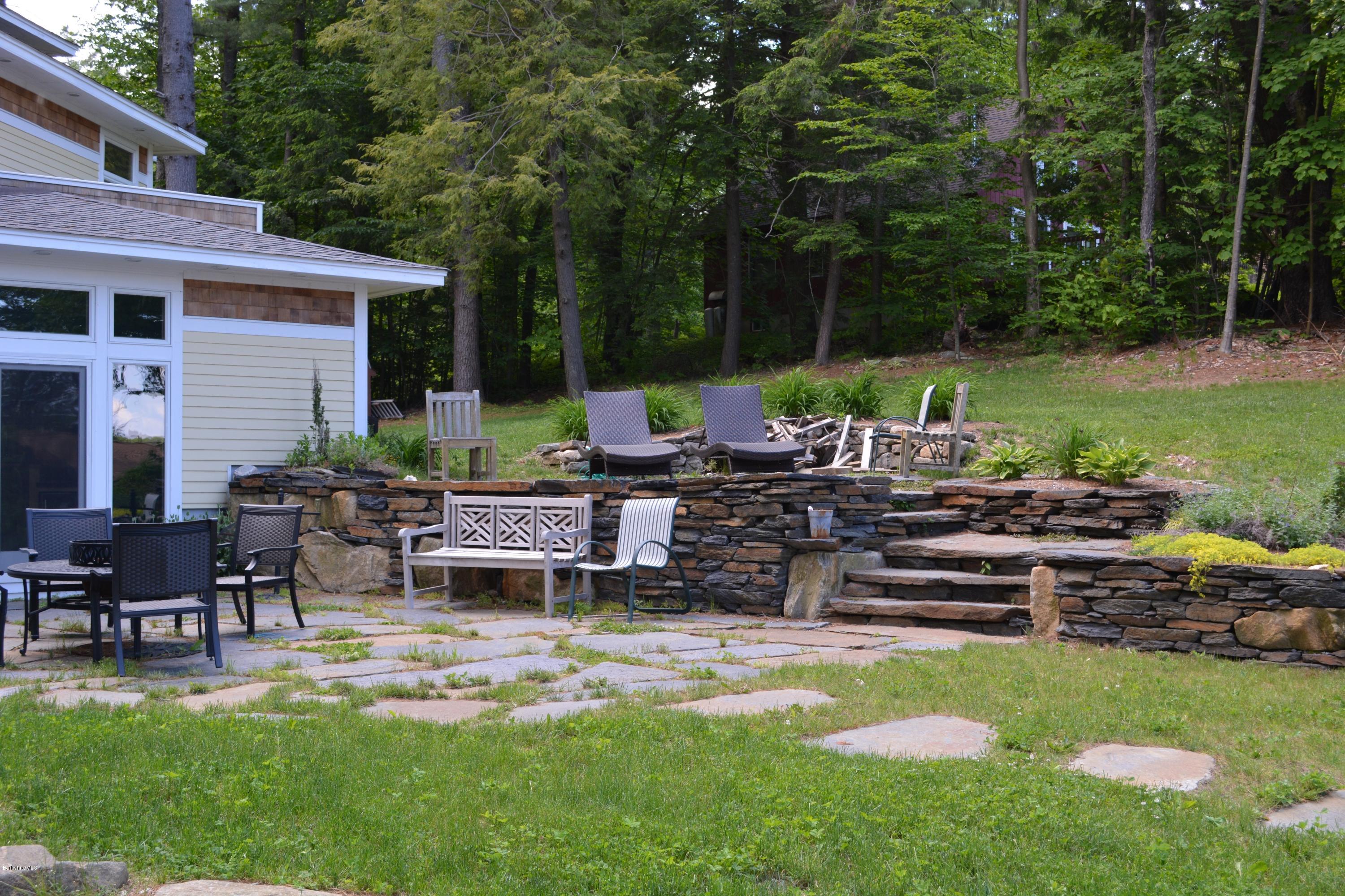 317 Pine Road Otis, MA 01029 - Photo 13 of 27 a view of a backyard with sitting area and furniture
