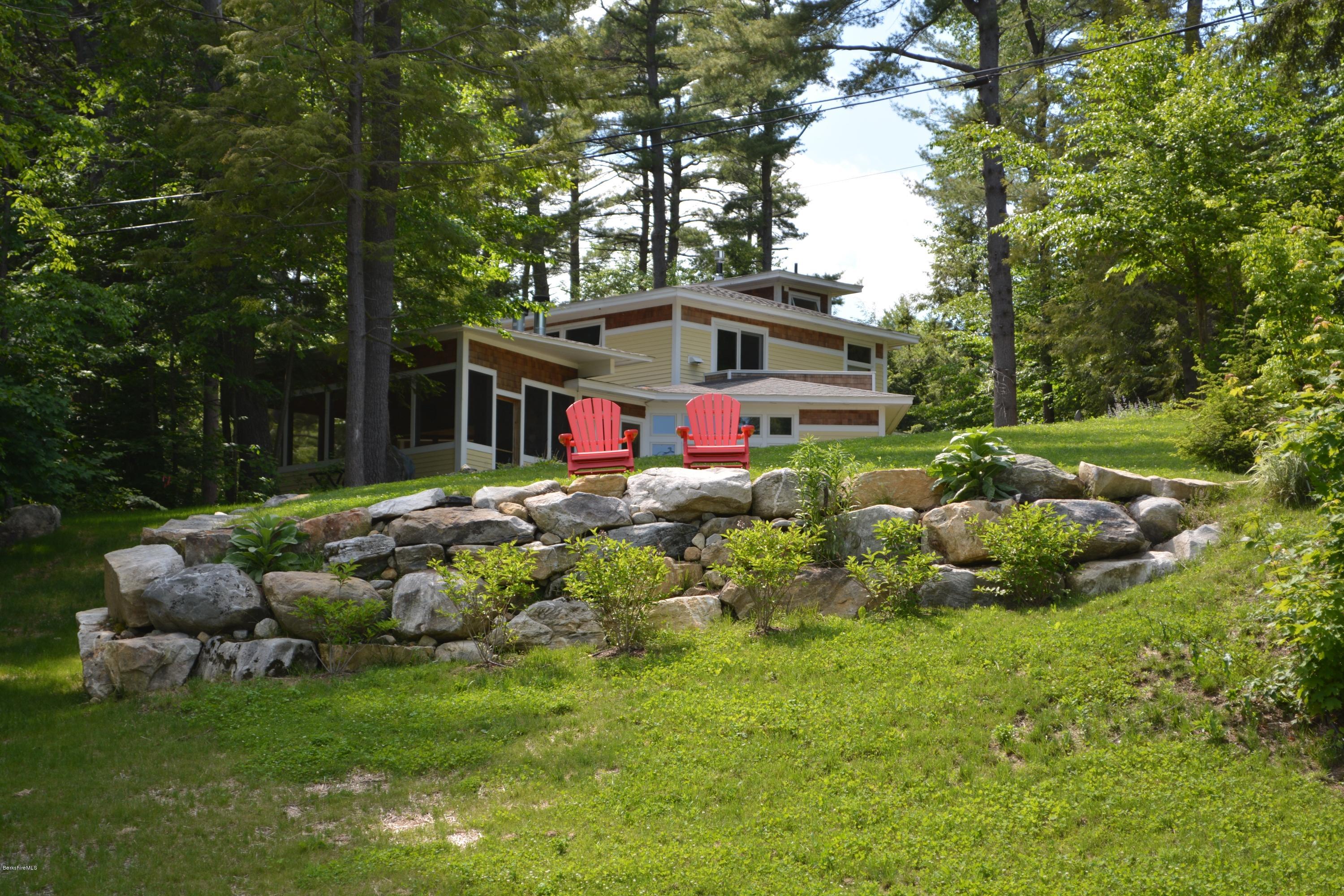 317 Pine Road Otis, MA 01029 - Photo 14 of 27 a front view of house with yard and green space