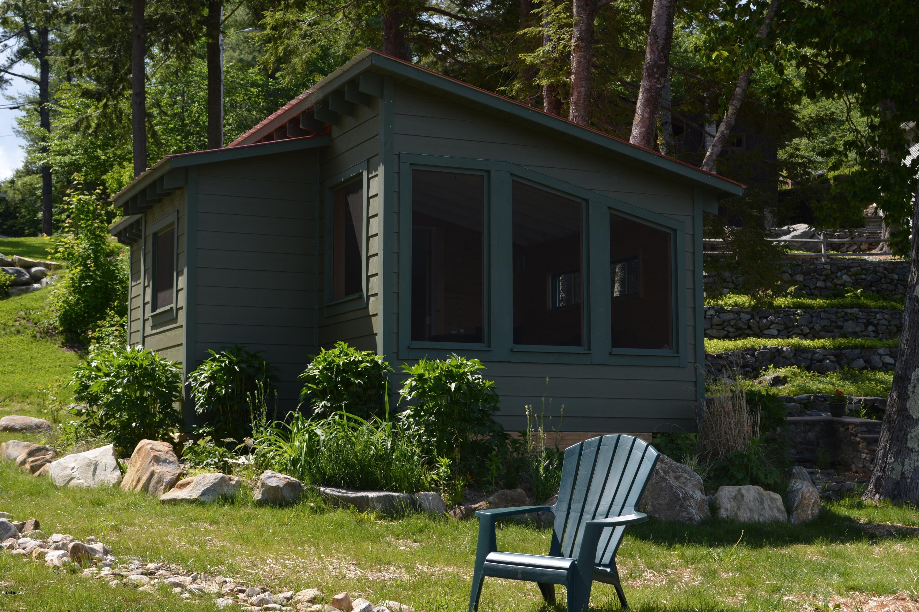 317 Pine Road Otis, MA 01029 - Photo 17 of 27 a backyard of a house with yard fire pit and outdoor seating