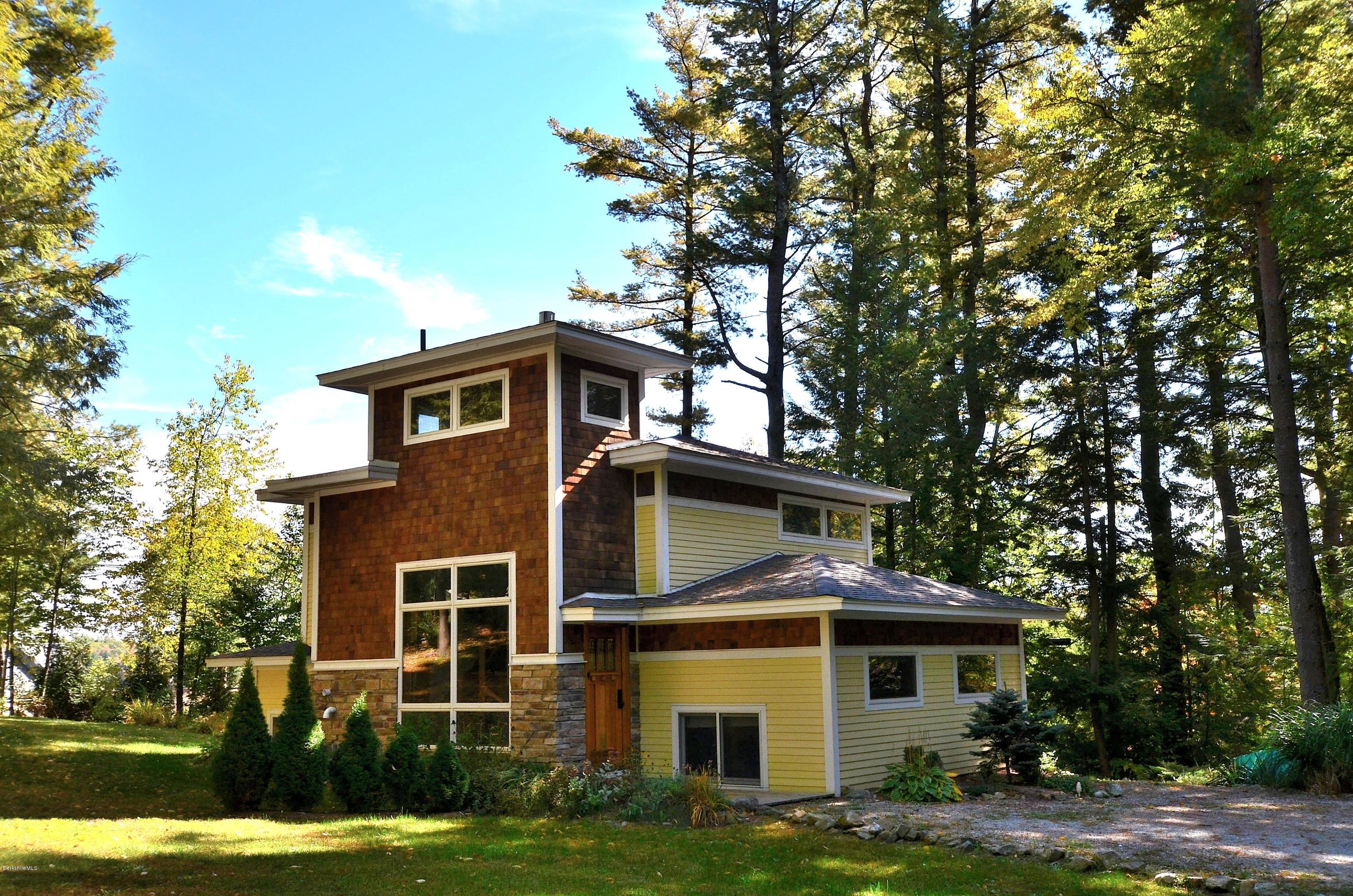 317 Pine Road Otis, MA 01029 - Photo 21 of 27 a front view of a house with a garden