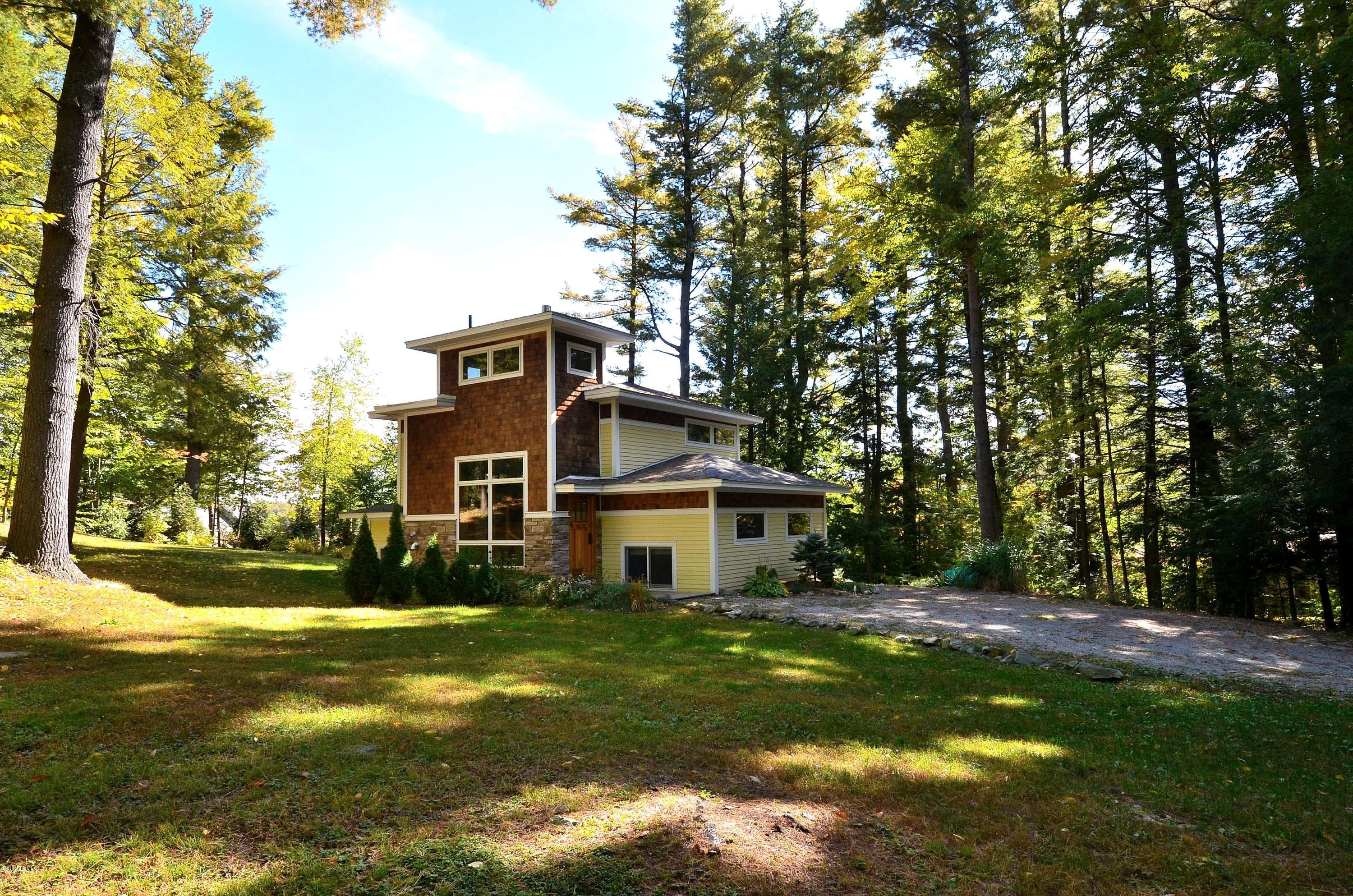 317 Pine Road Otis, MA 01029 - Photo 22 of 27 a front view of house with yard and green space
