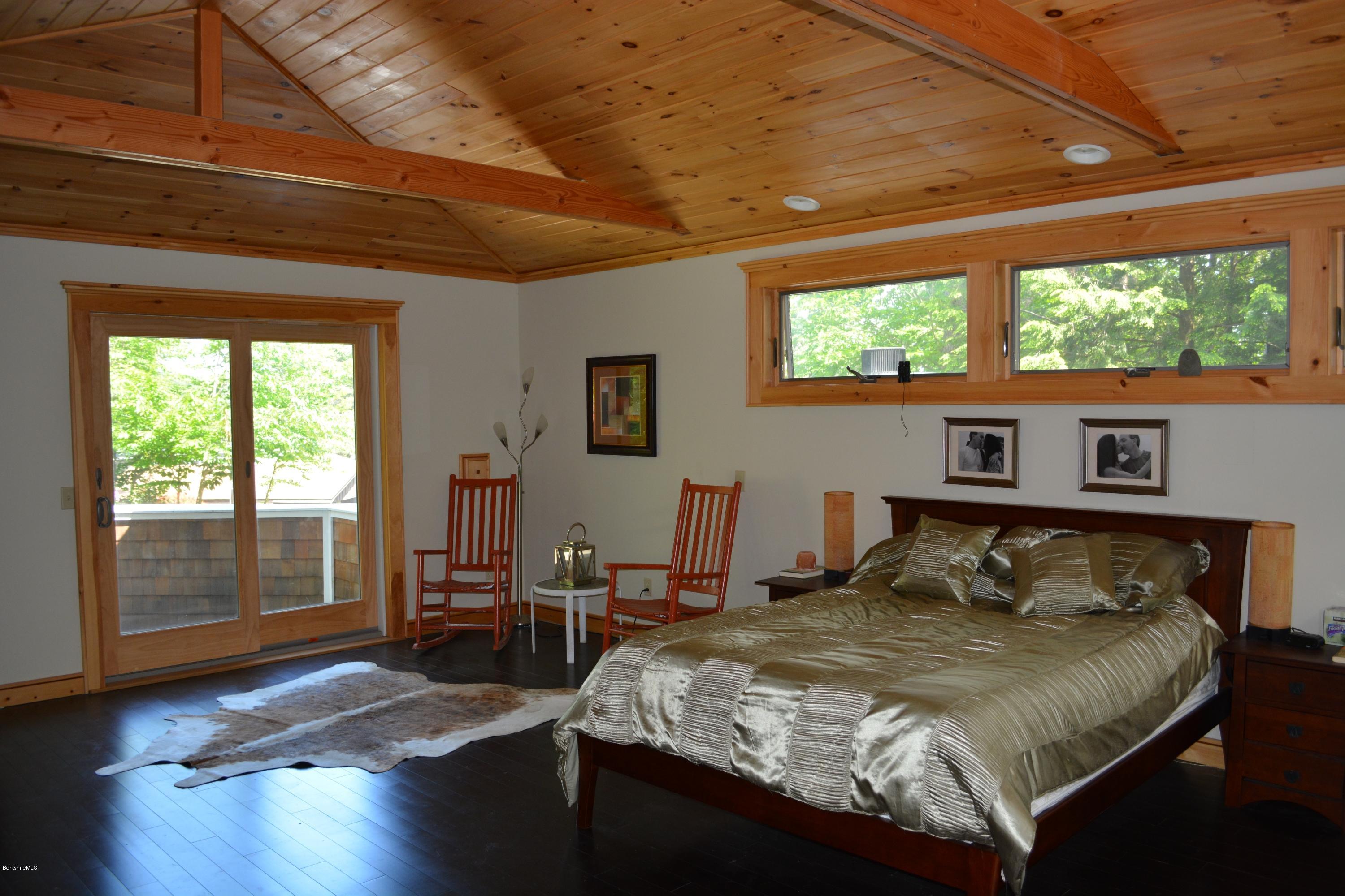 317 Pine Road Otis, MA 01029 - Photo 7 of 27 a bedroom with a bed and wooden floor
