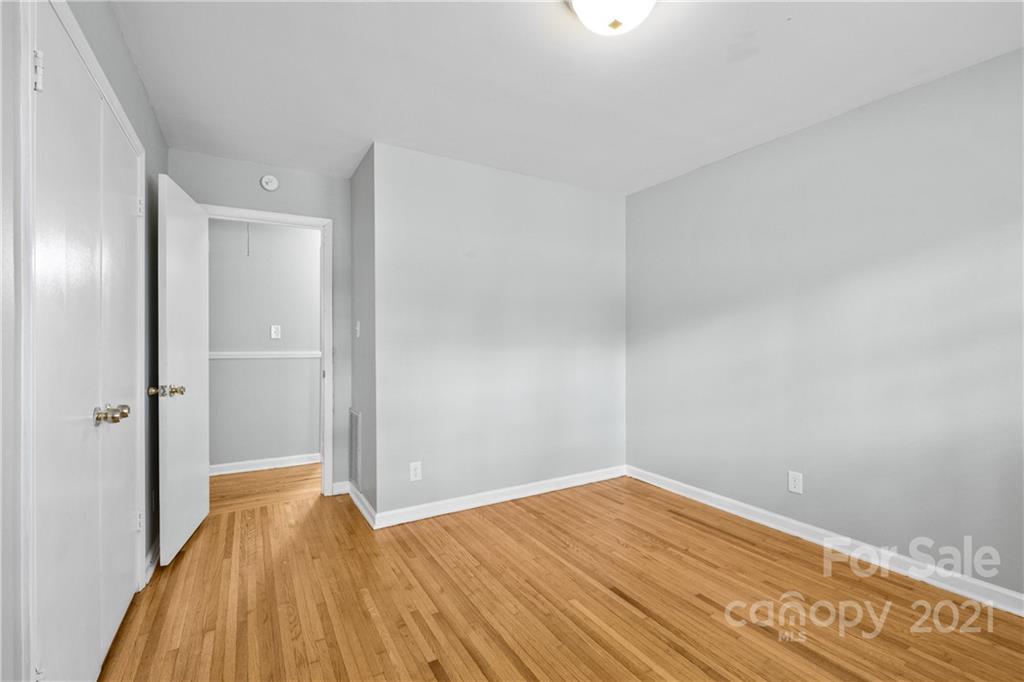 6833 Idlewild Road Charlotte, NC 28212 - Photo 15 of 24 a view of empty room with wooden floor