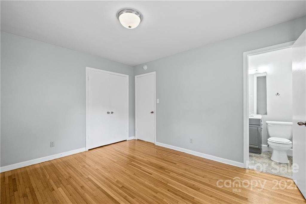 6833 Idlewild Road Charlotte, NC 28212 - Photo 18 of 24 a view of a room with wooden floor and toilet
