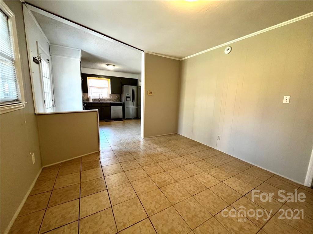 6833 Idlewild Road Charlotte, NC 28212 - Photo 6 of 24 a view of a storage & utility room with a sink